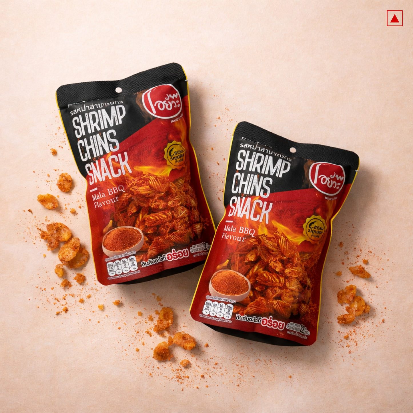 Two packages of Shrimp Chins snack on a beige background with scattered snacks.