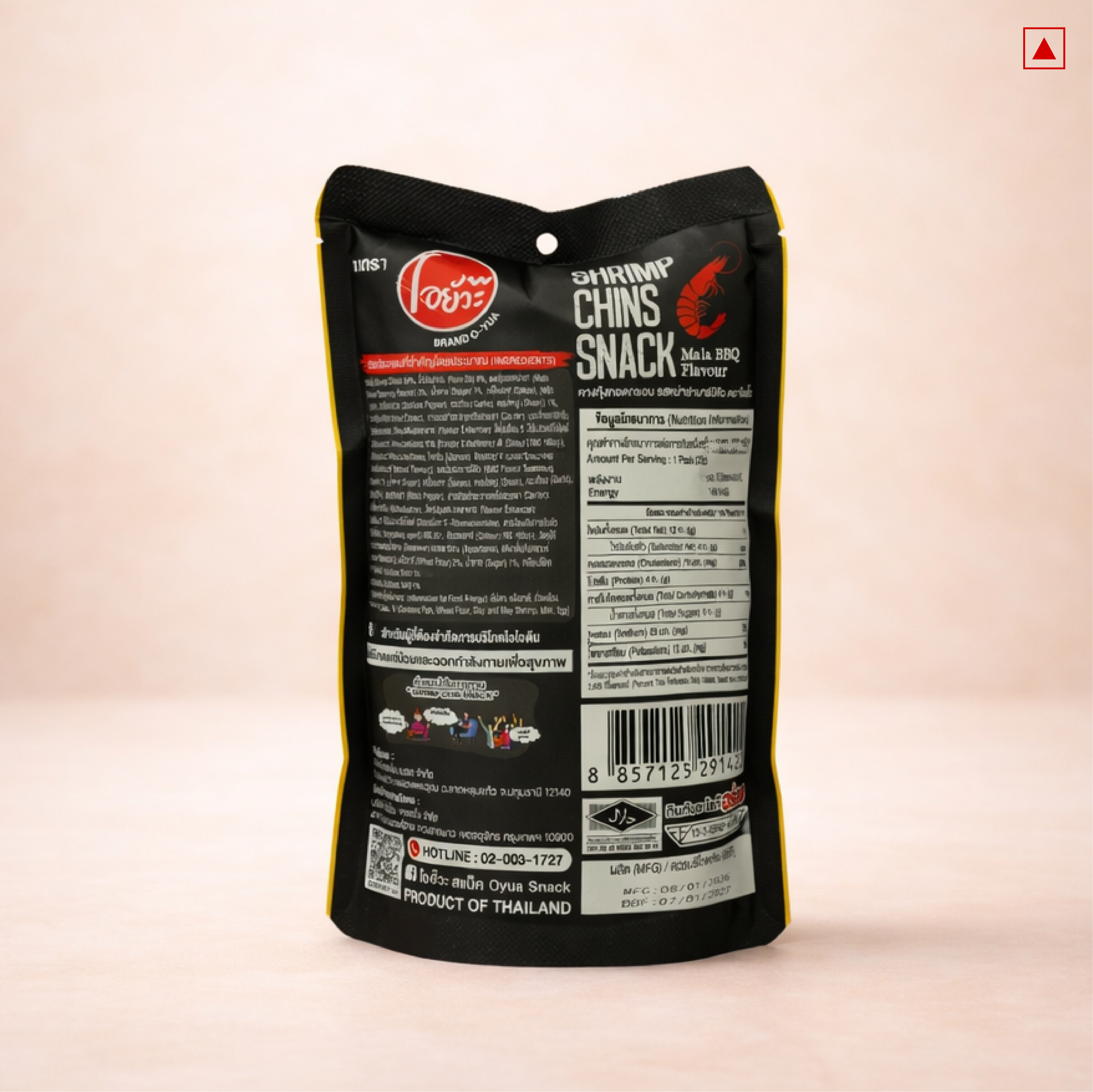 Black snack package with text and branding on a light pink background