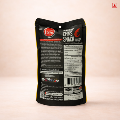 Black snack package with text and branding on a light pink background