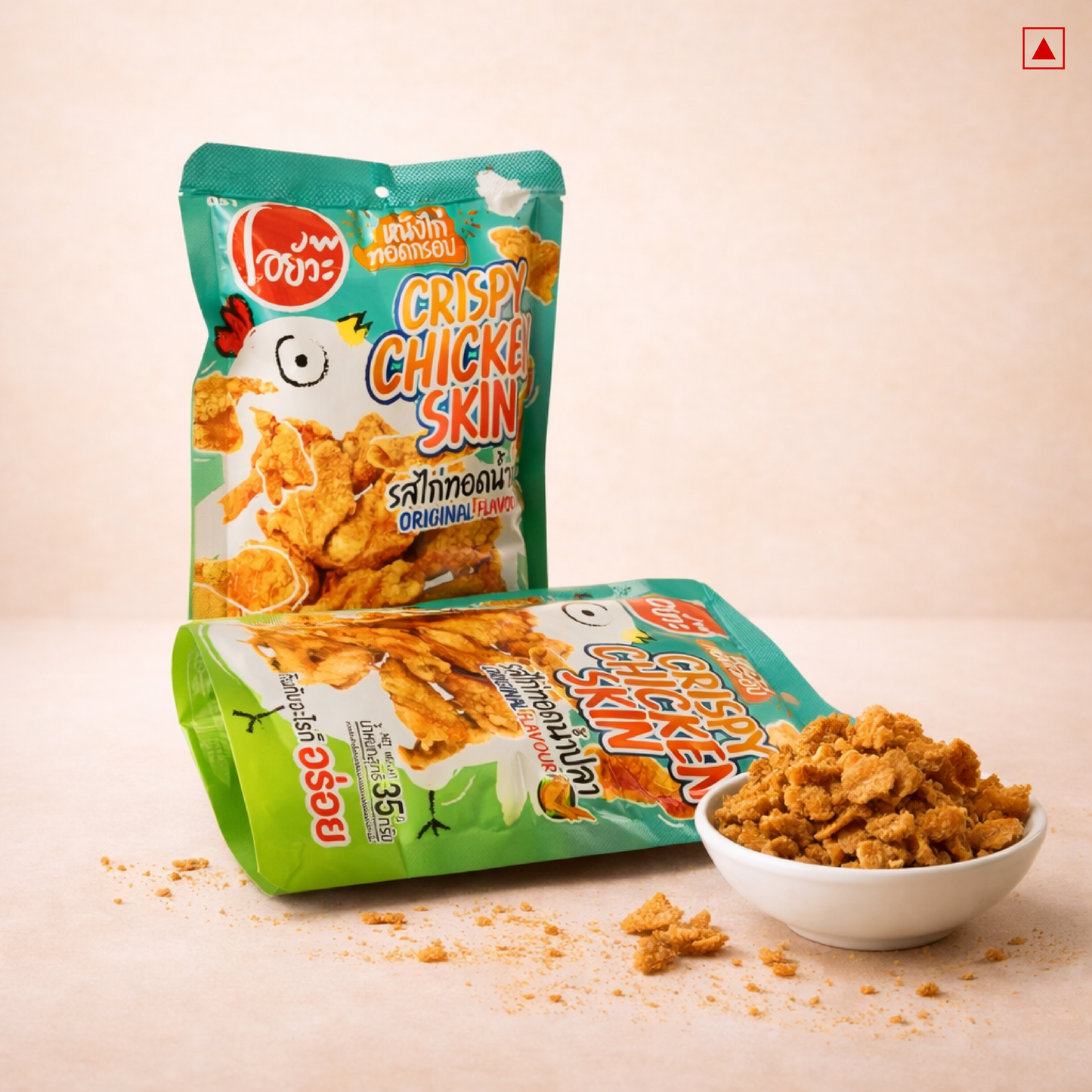 Packaging and bowl of crispy chicken skin snacks on a beige background