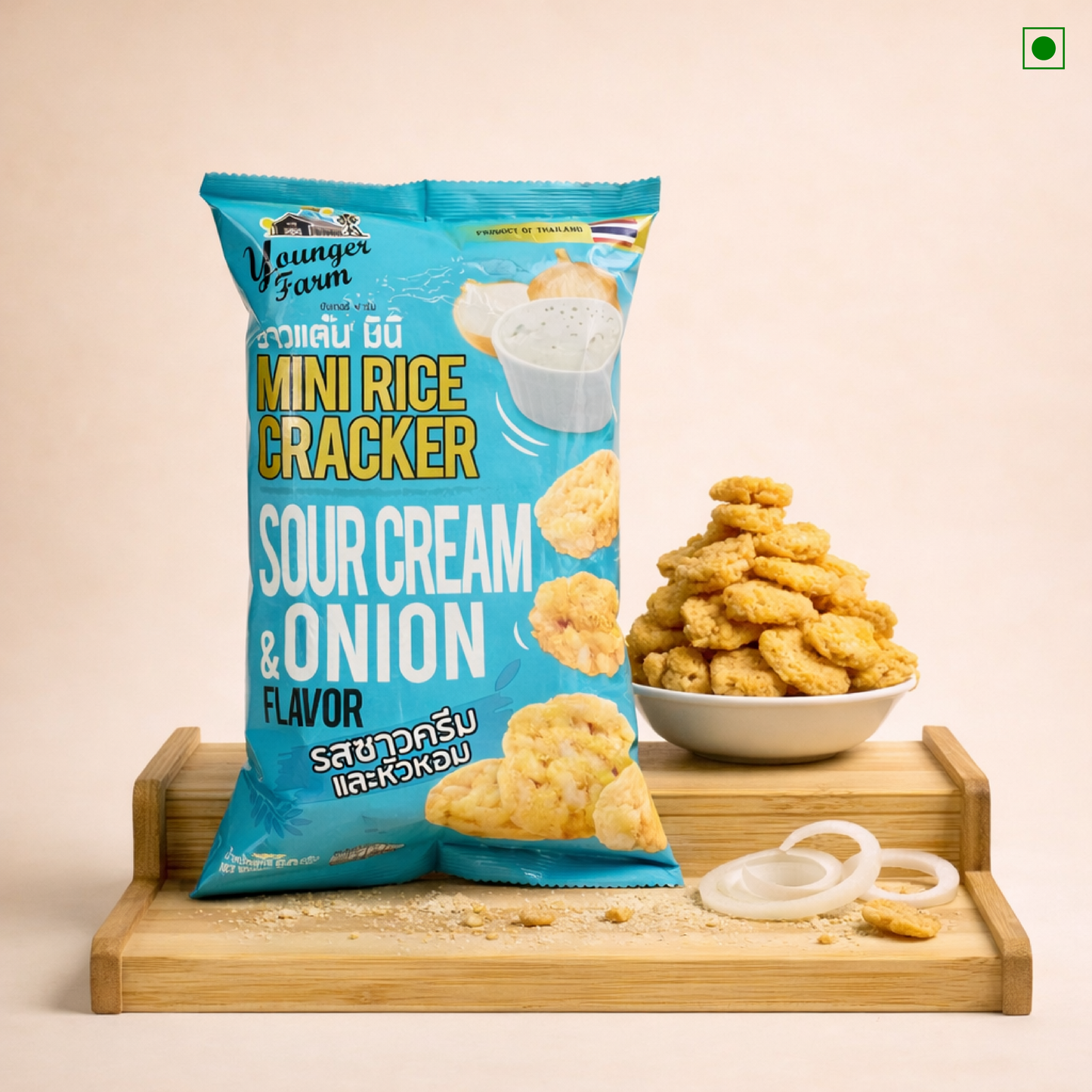 Packaged mini rice crackers with sour cream and onion flavor on a beige background