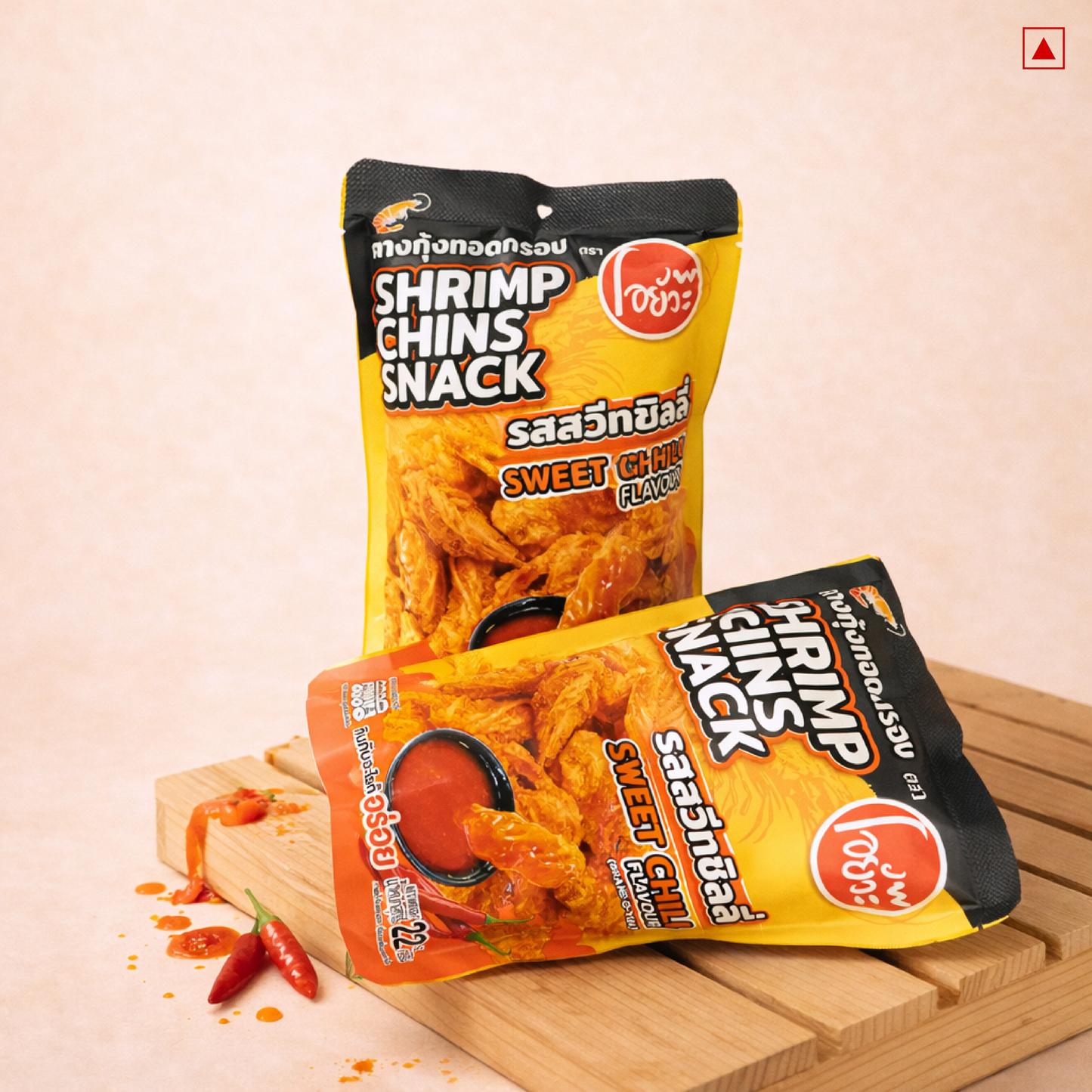 Two packages of shrimp chins snack on a wooden board with a light background