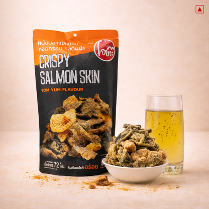 Crispy salmon skin snack package with a bowl of snacks and a glass of beer on a light background