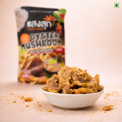 Oyster mushroom snack in a bowl with a branded packaging in the background
