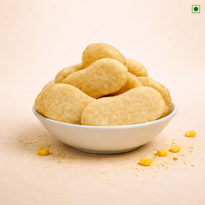 White bowl filled with yellow snacks on a beige background