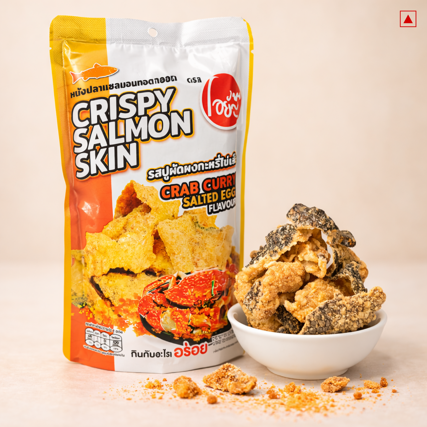 Packaged snack of crispy salmon skin with crab curry salted egg flavor on a beige background