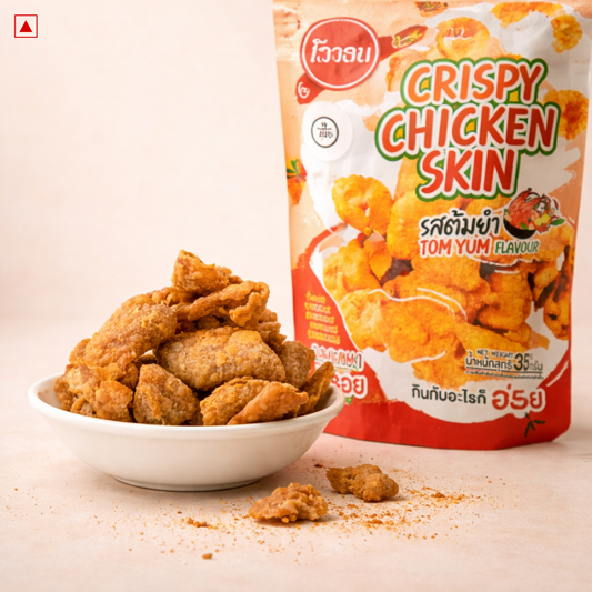 Bowl of crispy chicken skin next to the OYUA Tom Yum pack