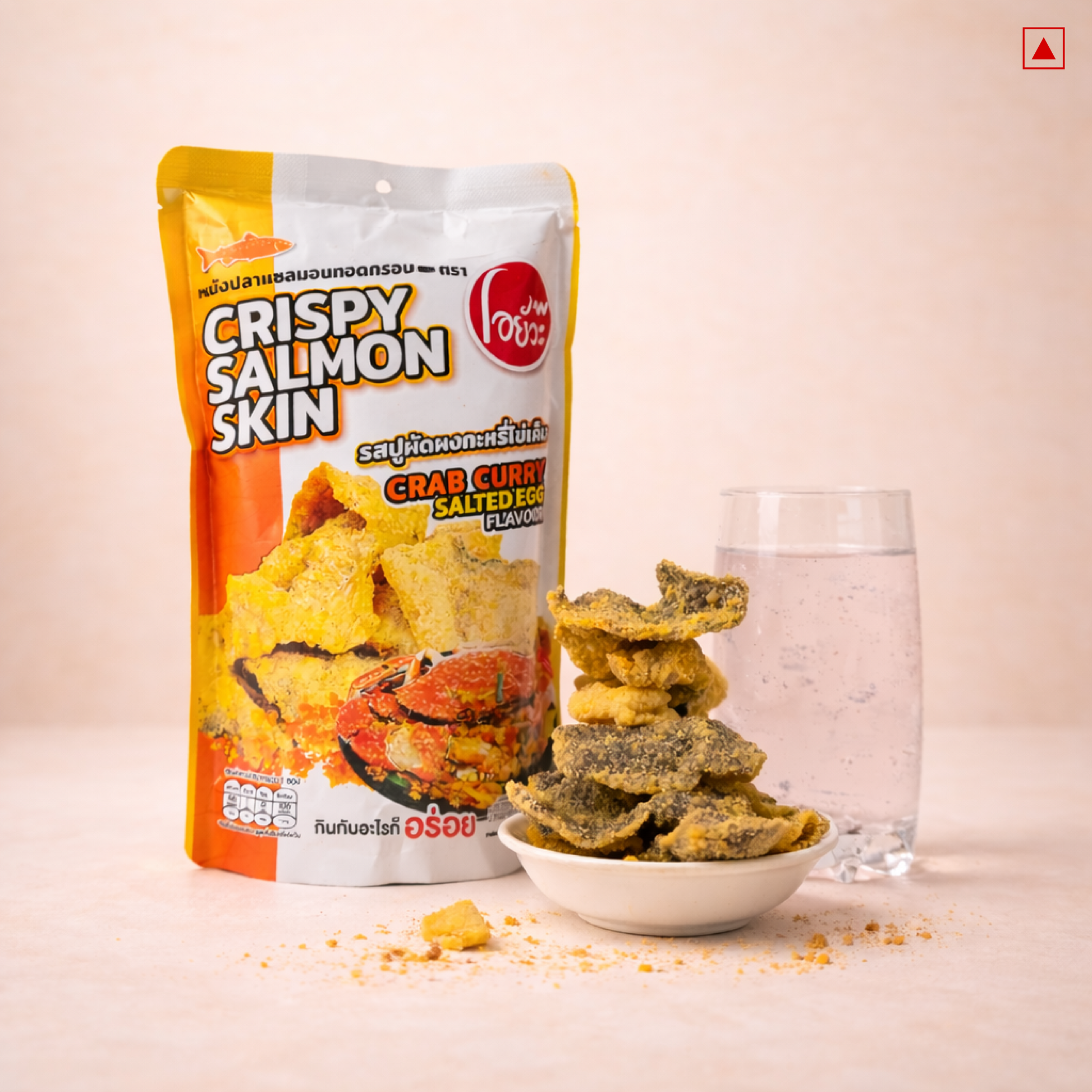 Packaged crispy salmon skin snack with a glass of water on a light background