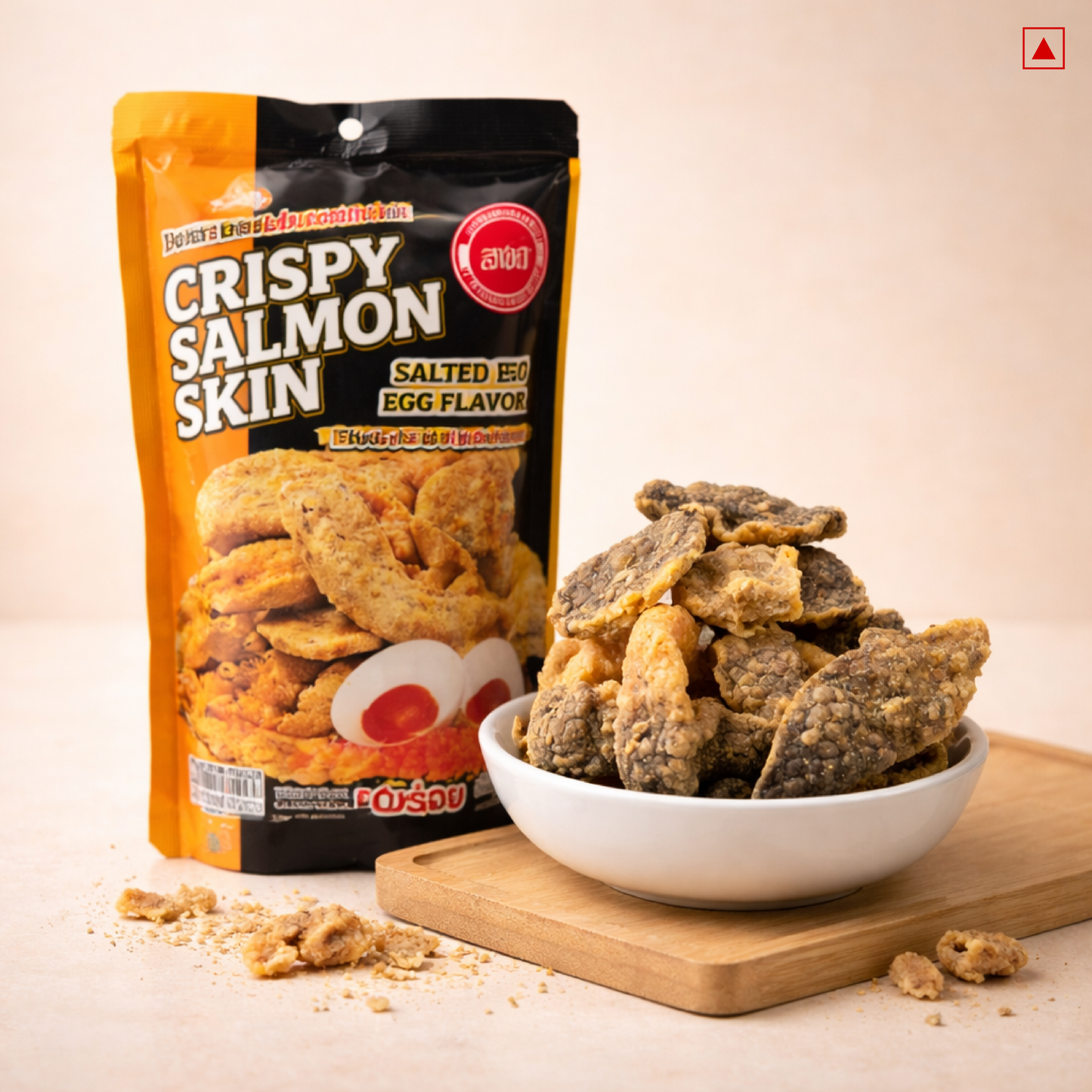Crispy salted egg salmon skin served in a bowl on a wooden board